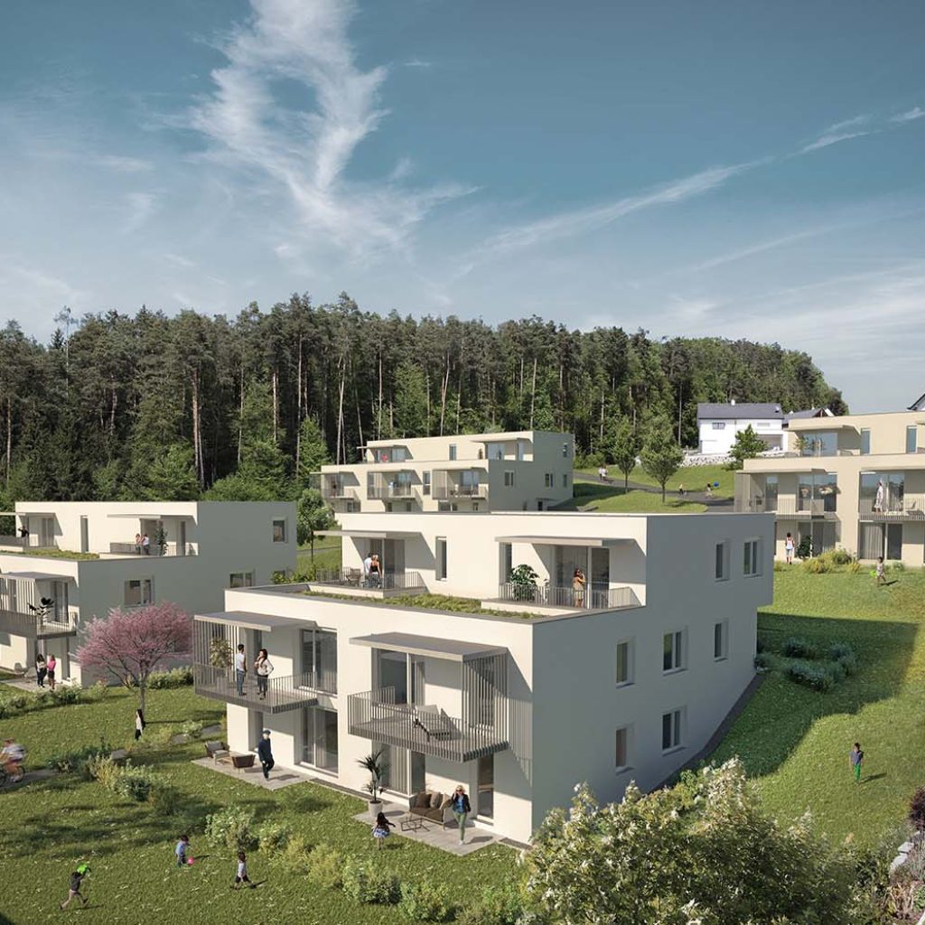 Mehrere mehrgeschoßige Wohnbauten, umgeben von viel Grün