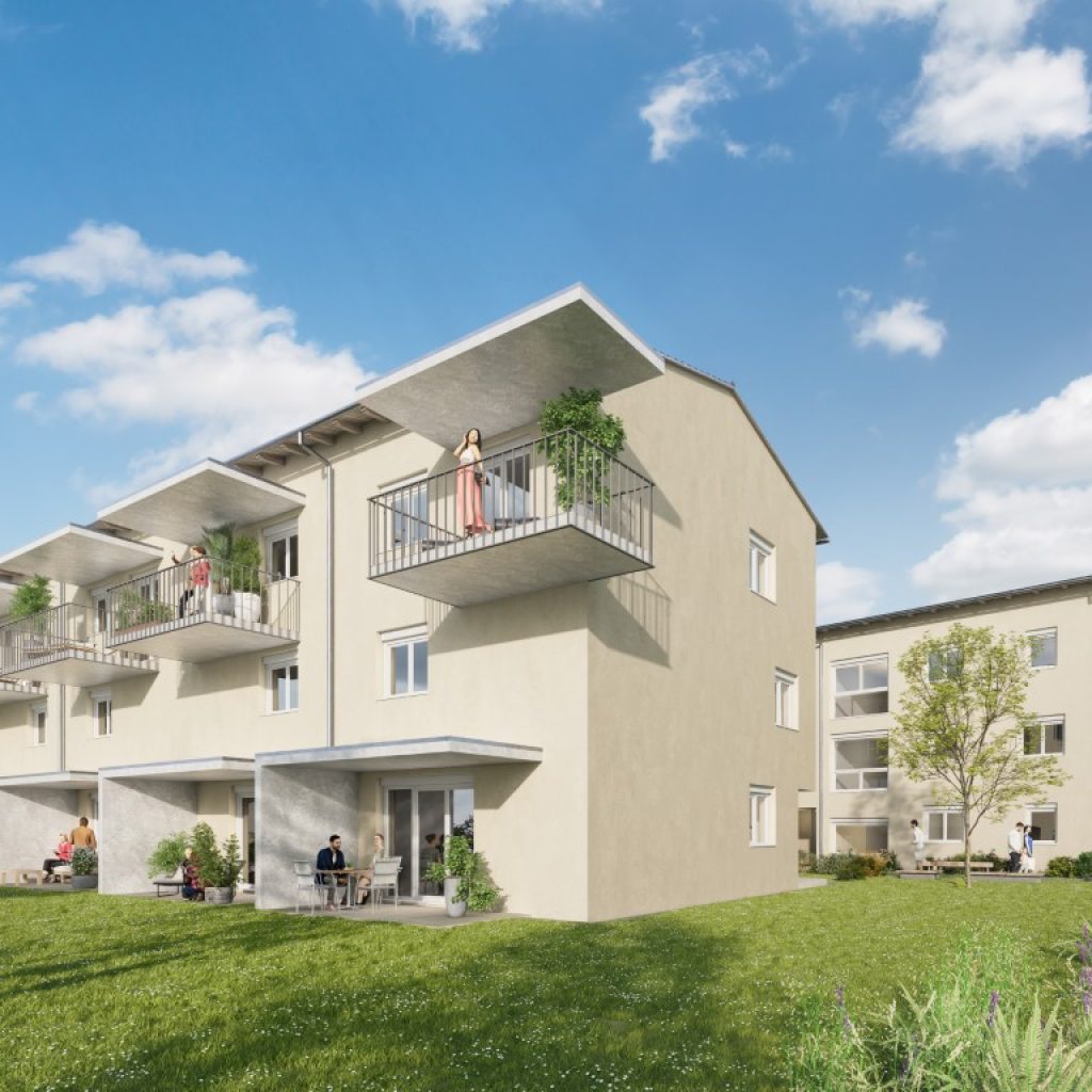 Mehrgeschoßige Wohnbauten mit Balkonen und Terrassen, umgeben von Grün